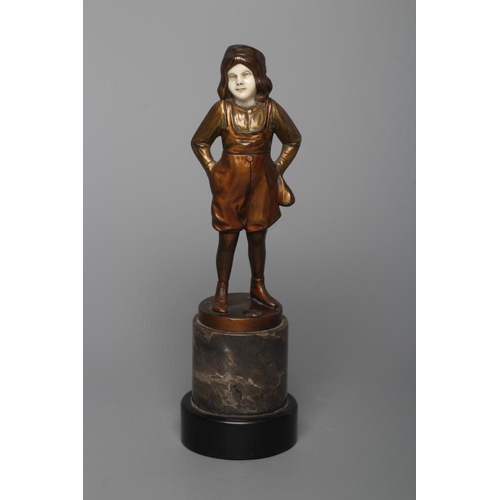 385 - B. GRUNDMANN - An Art Deco bronze figure cast as a young boy with carved ivory face wearing a cap on... 