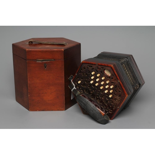 386 - A LACHENAL & CO. CONCERTINA of typical hexagonal form, with fret carved scroll design to both ends, ... 