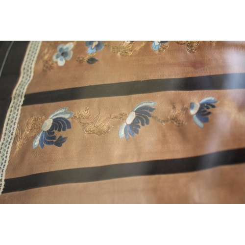 399 - A CHINESE PLEATED SKIRT with black silk satin gores, and blue embroidered foliate panels, with couch... 