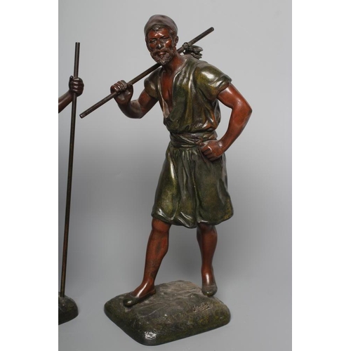 400 - A PAIR OF PAINTED SPELTER ARAB MALE WATER CARRIERS, after Marcel Debut (1865-1933) each modelled sta... 