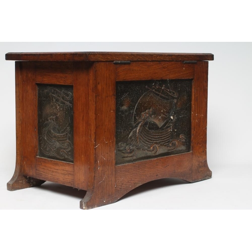 409 - AN ARTS AND CRAFTS OAK COAL BOX, c.1900, of oblong tapering form, the hinged lid and sides inset wit... 