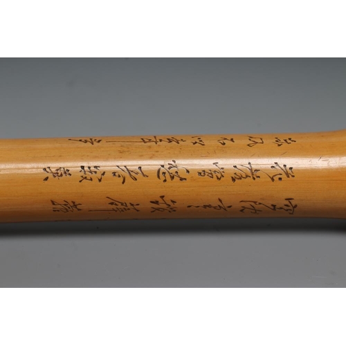 431 - A JAPANESE WALKING CANE, the bone grip carved in relief with a Samurai killing a tiger, bamboo shaft... 