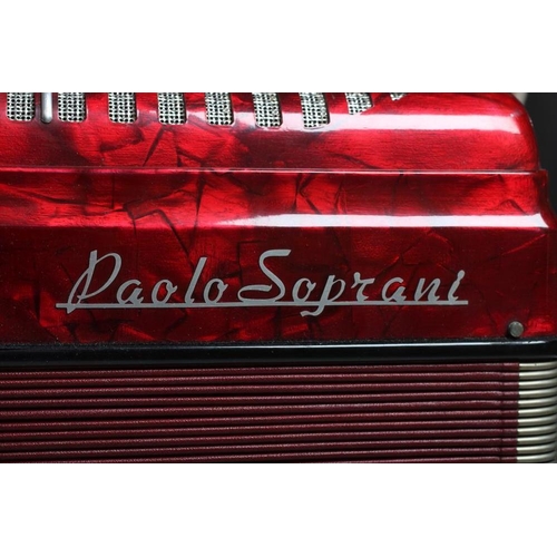 437 - A PAOLO SOPRANI BUTTON ACCORDIAN with red marbled effect case, leather strapping and hard case (Est.... 