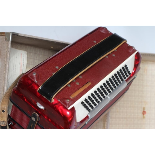 437 - A PAOLO SOPRANI BUTTON ACCORDIAN with red marbled effect case, leather strapping and hard case (Est.... 