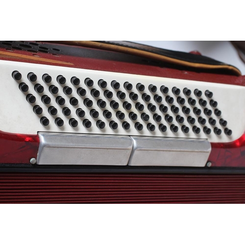 437 - A PAOLO SOPRANI BUTTON ACCORDIAN with red marbled effect case, leather strapping and hard case (Est.... 