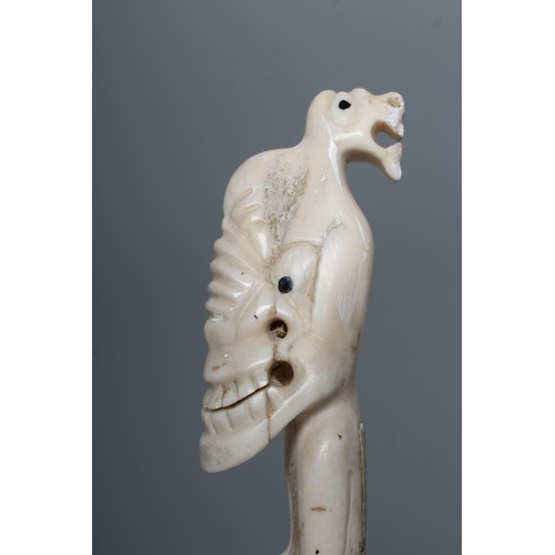 439 - A CARVED INUIT TOTEM, made of polar bear bone, from Kulusuk-Kap Dam, Greenland, with three faces and... 