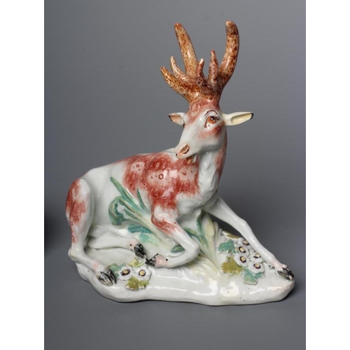 44 - A DERBY PORCELAIN STAG AND HIND, c.1760, each modelled recumbent on a flower encrusted shaped base, ... 