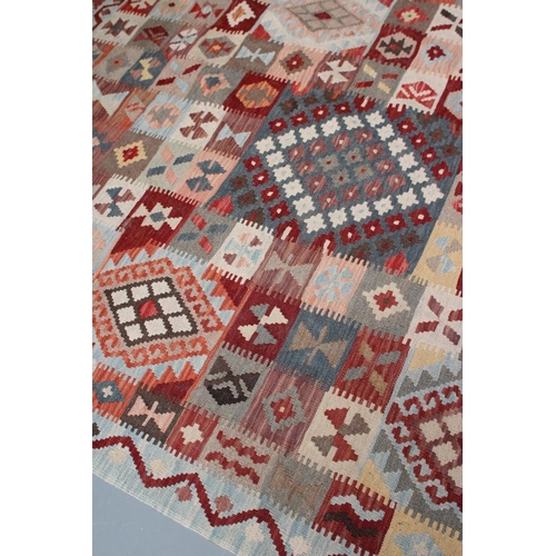 443 - A KILIM, modern, the pale blue ground in an overall geometric pattern small square in rust, brown an... 