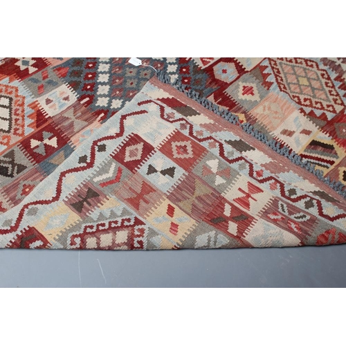 443 - A KILIM, modern, the pale blue ground in an overall geometric pattern small square in rust, brown an... 