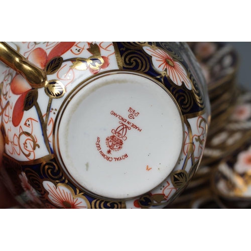 55 - A ROYAL CROWN DERBY IMARI CHINA TEA SET for six place settings, 1917, decorated in pattern 2451, pri... 