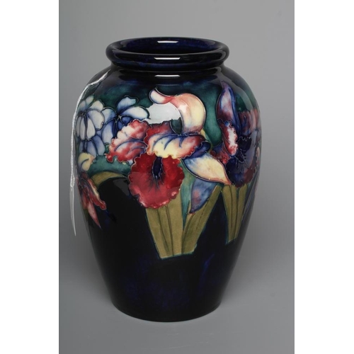 56 - A MOORCROFT POTTERY ORCHID PATTERN VASE, mid 20th century, of ovoid form, tubelined and painted in t... 