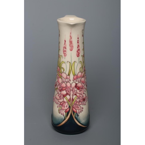 64 - A MOORCROFT POTTERY CORNISH HEATH PATTERN EWER, 2018, of tapering cylindrical form, tubelined and pa... 