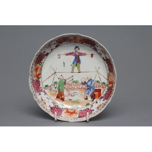 7 - A CHINESE PORCELAIN FAMILLE ROSE TEA BOWL AND SAUCER painted with a tightrope walker and a knife thr... 