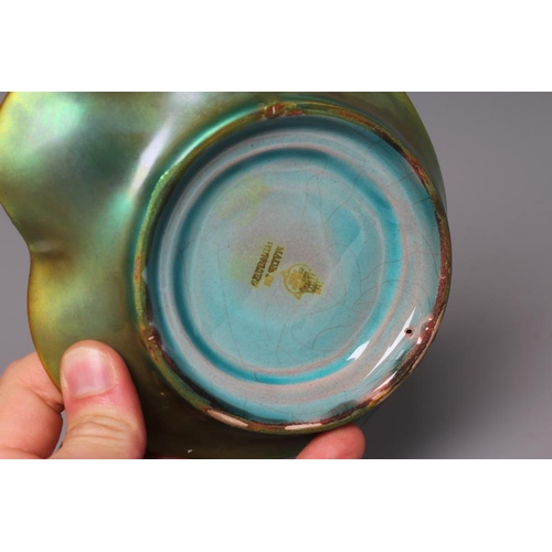 76 - A ZSOLNAY PECS GREEN IRIDESCENT POTTERY FIGURAL DISH, mid 20th century, modelled as a scantily drape... 