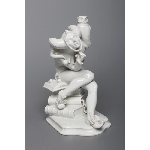 85 - A MEISSEN BLANC-DE-CHINE PORCELAIN FIGURE, mid 20th century, modelled as a jester with an owl perche... 