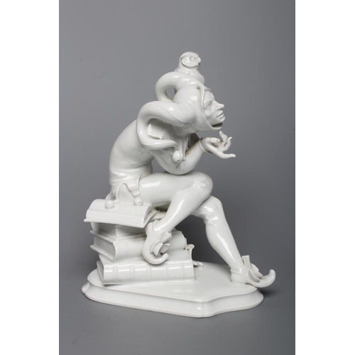 85 - A MEISSEN BLANC-DE-CHINE PORCELAIN FIGURE, mid 20th century, modelled as a jester with an owl perche... 