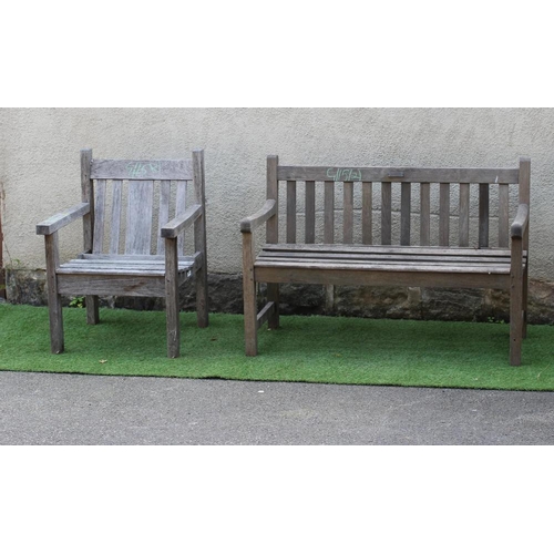 745 - A SLATTED TEAK BENCH with straight back and square section arm suppports and feet, 48