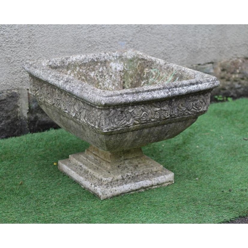 746 - A CAST STONE PLANTER of square form with moulded rim over a band of flower heads, raised on a steppe... 