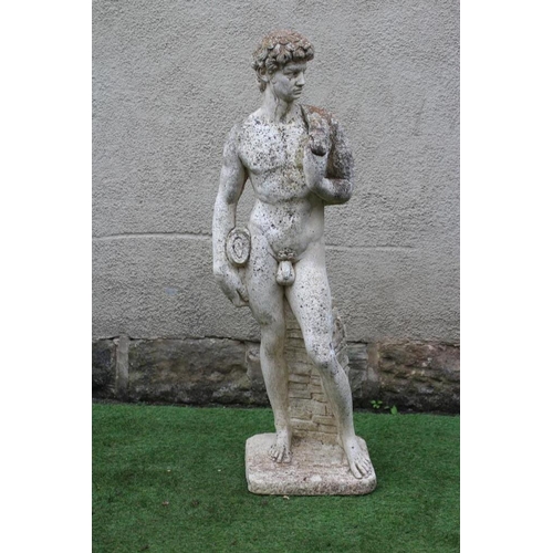 748 - A CAST STONE FIGURE OF DAVID after Michelangelo, on an oblong base, 13