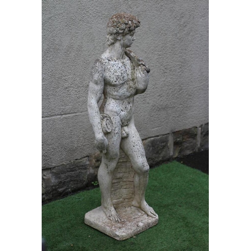 748 - A CAST STONE FIGURE OF DAVID after Michelangelo, on an oblong base, 13