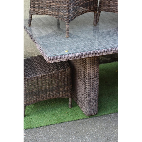 764 - AN ALL WEATHER RESIN WEAVE DINING SUITE, the oblong table with separate glass, raised on a pair of s... 