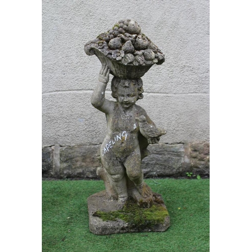 767 - A CAST STONE FIGURE allegorical of Autumn, modelled as a Putto carrying a basket of fruit on his hea... 