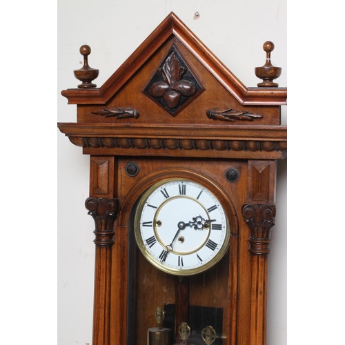 786 - A WALNUT VIENNA TYPE WALL CLOCK, c.1890, the triple weight driven movement striking on gongs, 6 1/4