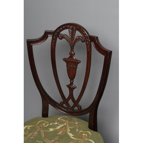 827 - A SET OF SIX MAHOGANY DINING CHAIRS, of Georgian design c.1900, the shield back with carved urn spla... 