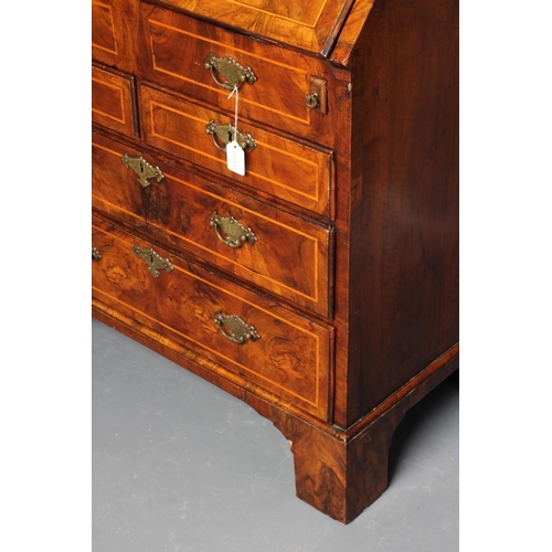 837 - A GEORGIAN WALNUT BUREAU, third quarter 18th century, the banded fallfront with stringing enclosing ... 