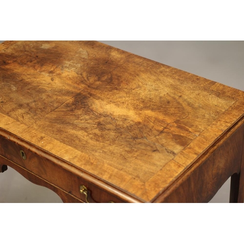 853 - A MAHOGANY LOWBOY, 18th century and later, the moulded edged quarter veneered and banded top over wa... 