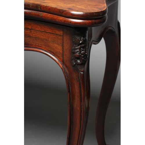 862 - A VICTORIAN ROSEWOOD FOLDING CARD TABLE of serpentine oblong form, the swivel top opening to interio... 