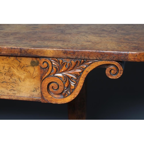 863 - AN EARLY VICTORIAN BURR OAK LIBRARY TABLE, the rounded oblong top over frieze drawer flanked on eith... 