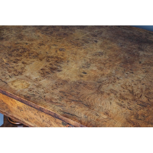 863 - AN EARLY VICTORIAN BURR OAK LIBRARY TABLE, the rounded oblong top over frieze drawer flanked on eith... 