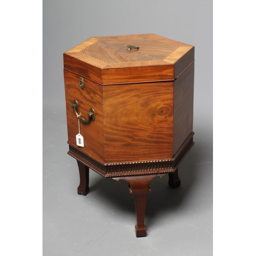 866 - A MAHOGANY CELLARETTE, 19th century, of hexagonal form crossbanded with chequer stringing, brass loo... 