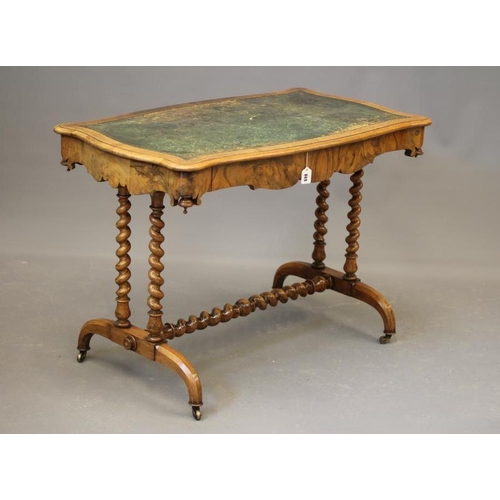 869 - A VICTORIAN WALNUT LIBRARY TABLE, the moulded edged serpentine top inset with green leather, waved f... 