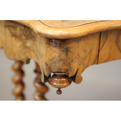 869 - A VICTORIAN WALNUT LIBRARY TABLE, the moulded edged serpentine top inset with green leather, waved f... 