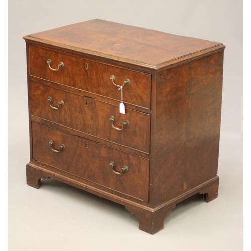 870 - A POLLARD OAK VENEERED CHEST, the moulded edged and banded top with stringing, three long drawers wi... 