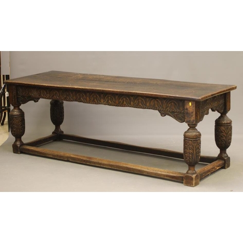 873 - A JOINED OAK DINING TABLE, 17th century and later, the cleated plank oblong top with lunette carved ... 