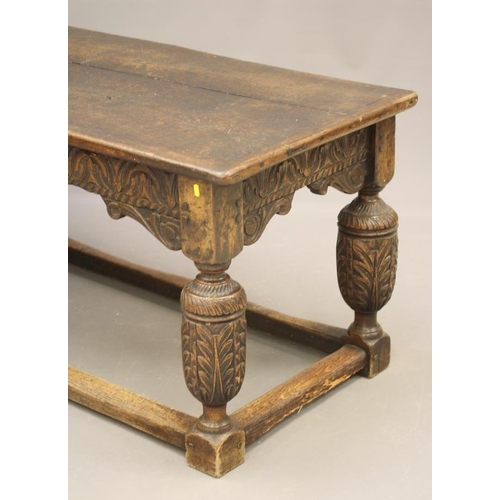 873 - A JOINED OAK DINING TABLE, 17th century and later, the cleated plank oblong top with lunette carved ... 