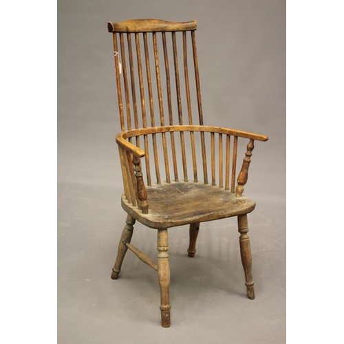 875 - A COMB BACK WINDSOR ARMCHAIR, 18th century, (AF) in ash and elm, arched top rail, baluster turned ar... 