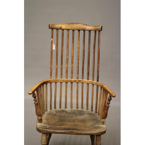 875 - A COMB BACK WINDSOR ARMCHAIR, 18th century, (AF) in ash and elm, arched top rail, baluster turned ar... 