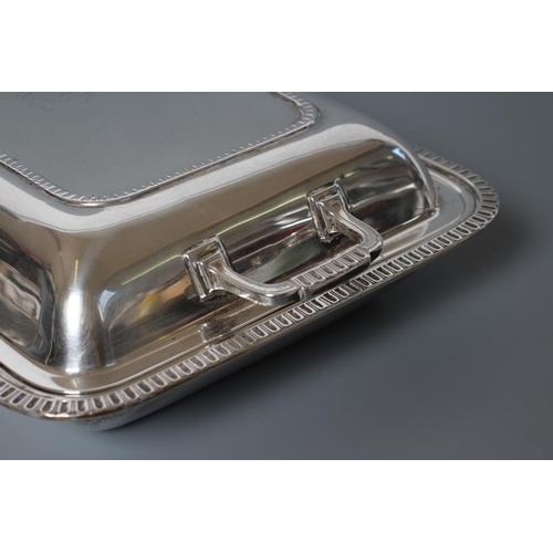 103 - A SMALL SILVER ENTREE DISH AND COVER, maker Mappin & Webb, Sheffield 1935, of plain rounded oblong f... 