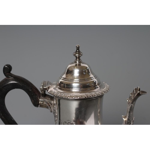 135 - A LATE VICTORIAN SILVER SMALL CAFE AU LAIT POT, maker Charles Stuart Harris, London 1894, of baluste... 