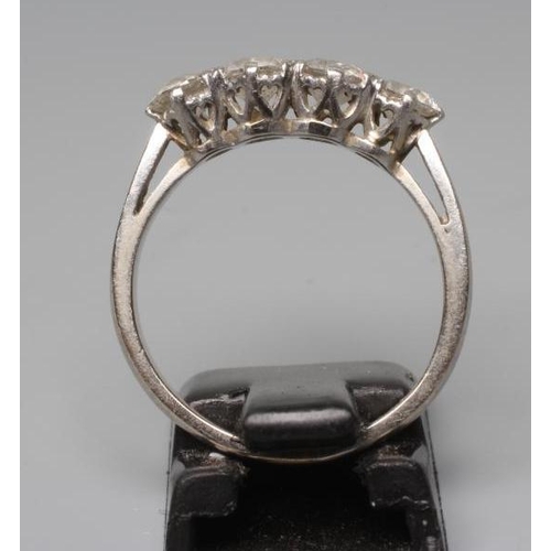 171 - A FOUR STONE DIAMOND RING, the old brilliant cut stones each of approximately 0.23cts, claw set to a... 