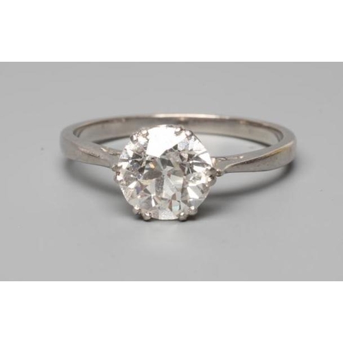 176 - A SOLITAIRE DIAMOND RING, the brilliant cut stone of approximately 1.50cts claw set to a plain, unma... 