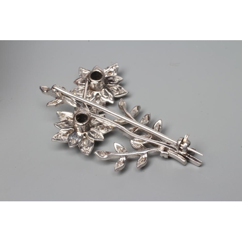 208 - A DIAMOND FLOWER SPRAY BROOCH, the two flowerhead clusters with three leafy branches to an unmarked ... 