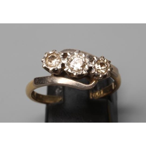 224 - A THREE STONE DIAMOND CROSSOVER RING, the round brilliant cut stones each of approximately 0.12cts, ... 