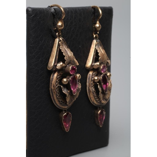 244 - A PAIR OF VICTORIAN EAR BOBS, the open leafy panels centred by mixed cut almandine garnets and hung ... 