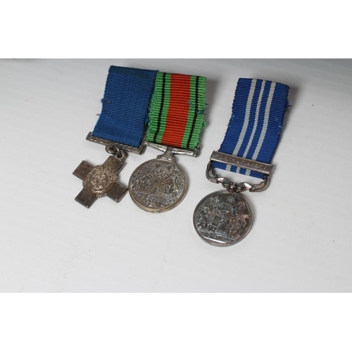 475 - A FAMILY OF MEDAL MINIATURES awarded to Thomas Hopper Alderson, comprising a George Cross, Defence M... 