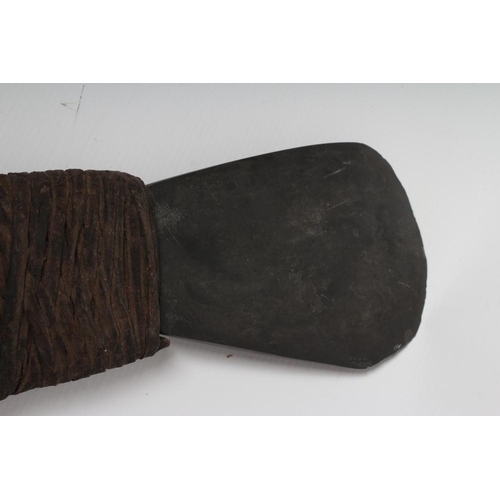 478 - A LARGE PAPUA NEW GUINEA HAGAN AXE with stone head, painted and carved rear head, wrappings and tape... 